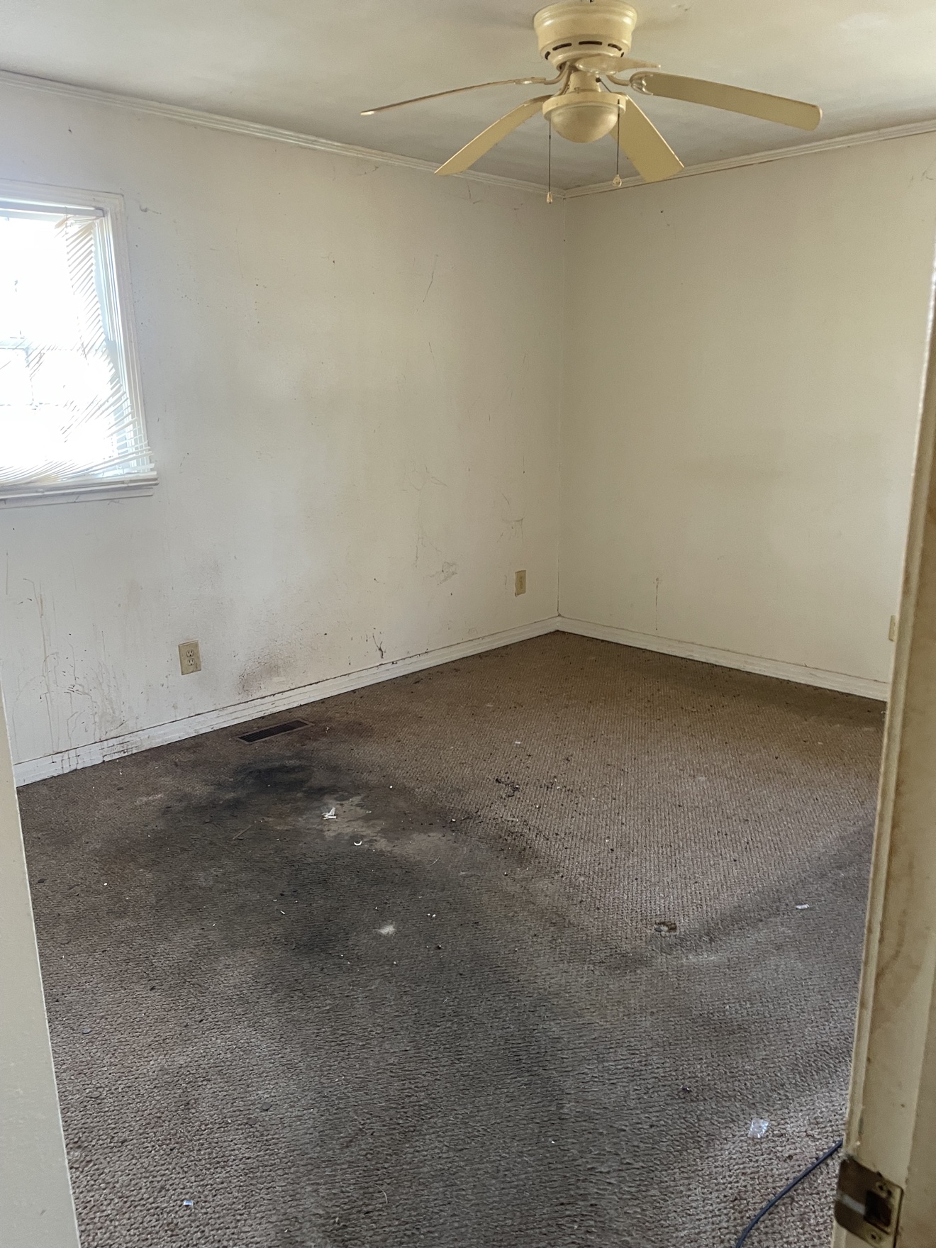 Same bedroom emptied after furniture and debris removal